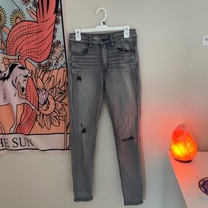 Grey acid wash high rise jeans.